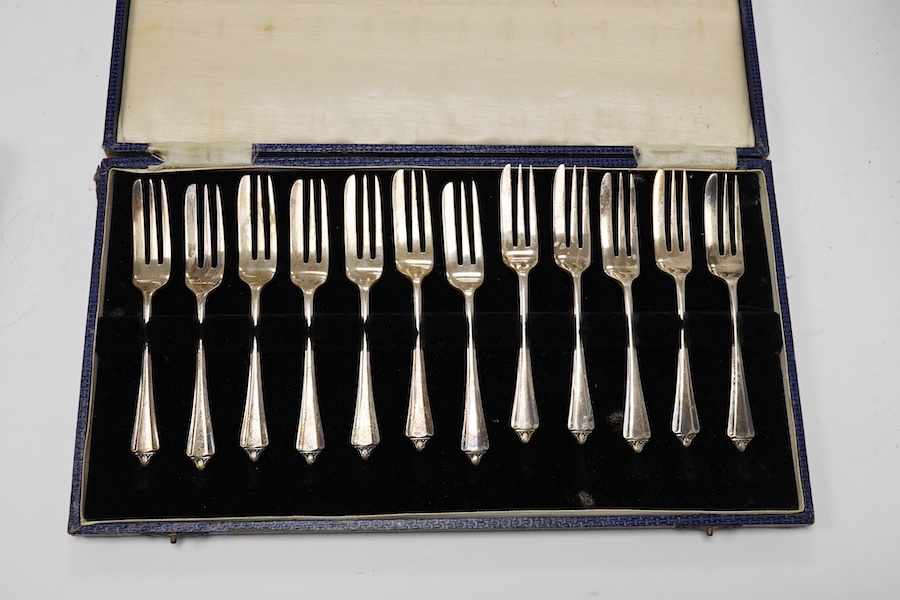 A cased set of twelve late Victorian silver coffee spoons, by Goldsmiths & Silversmiths Co Ltd, London, 1890 and three other later cased silver sets including six bean end coffee spoons, eight coffee spoons and twelve pa